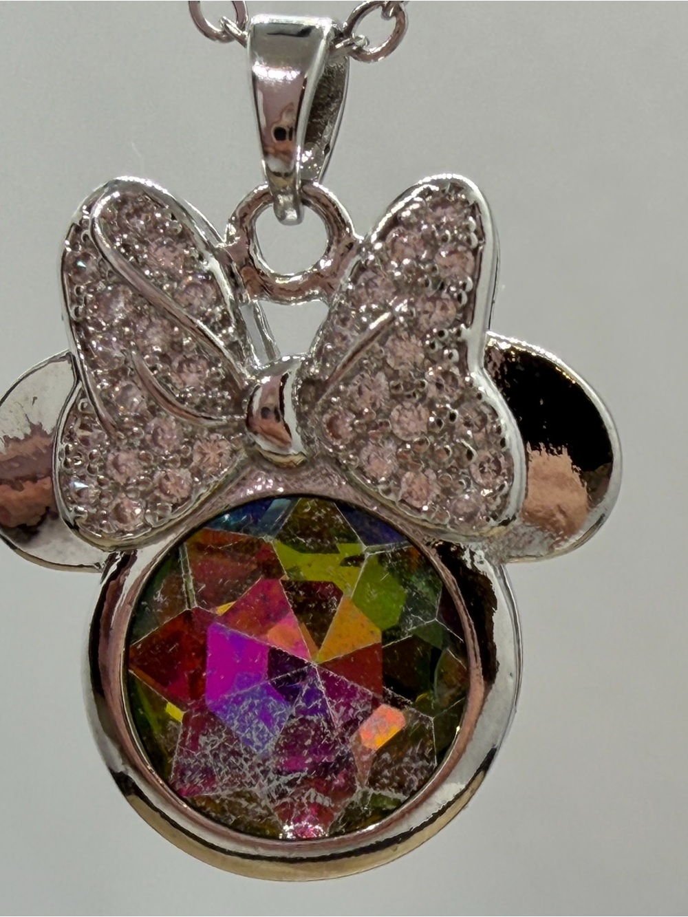 Silver Bow Pendant Necklace with Pink Crystal Accents and Iridescent Center